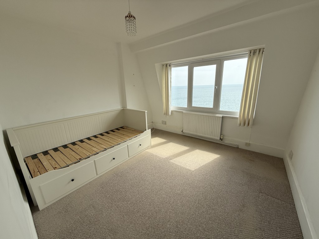 Lot: 124 - TOP FLOOR APARTMENT WITH STUNNING SEA VIEWS - Bedroom two and view of sea